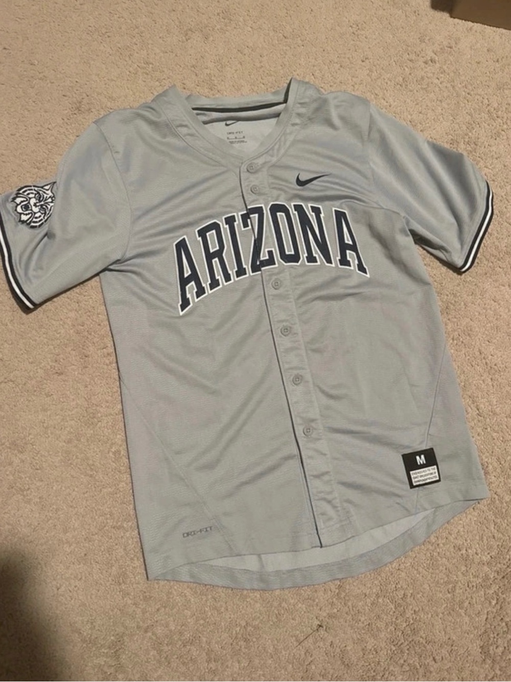 Nike Light Gray Arizona Baseball Jersey with Navy Lettering